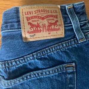 Levi 501 Midi medium wash Jean Shorts.
